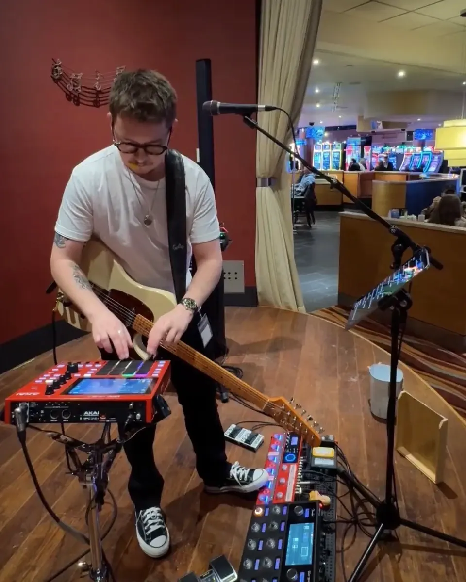 Daniel Humphreys playing guitar and creating live loops